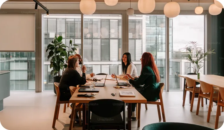 Everest Fleet team in a meeting around a long table in a bright office