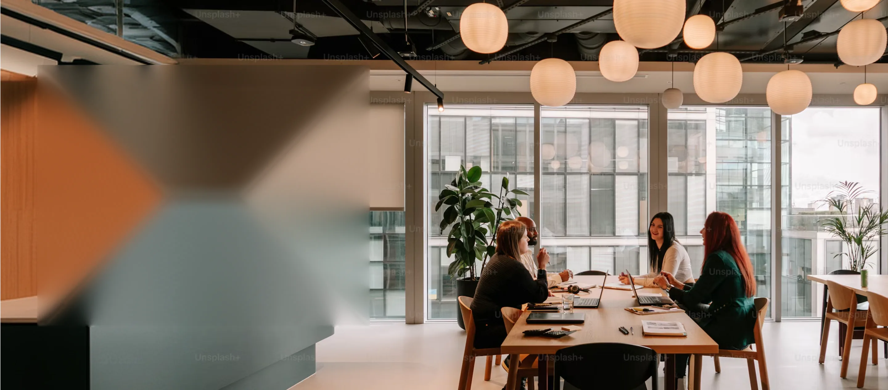 Everest Fleet team in a meeting around a long table in a bright office