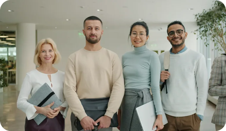 Four Everest Fleet colleagues standing together in the office