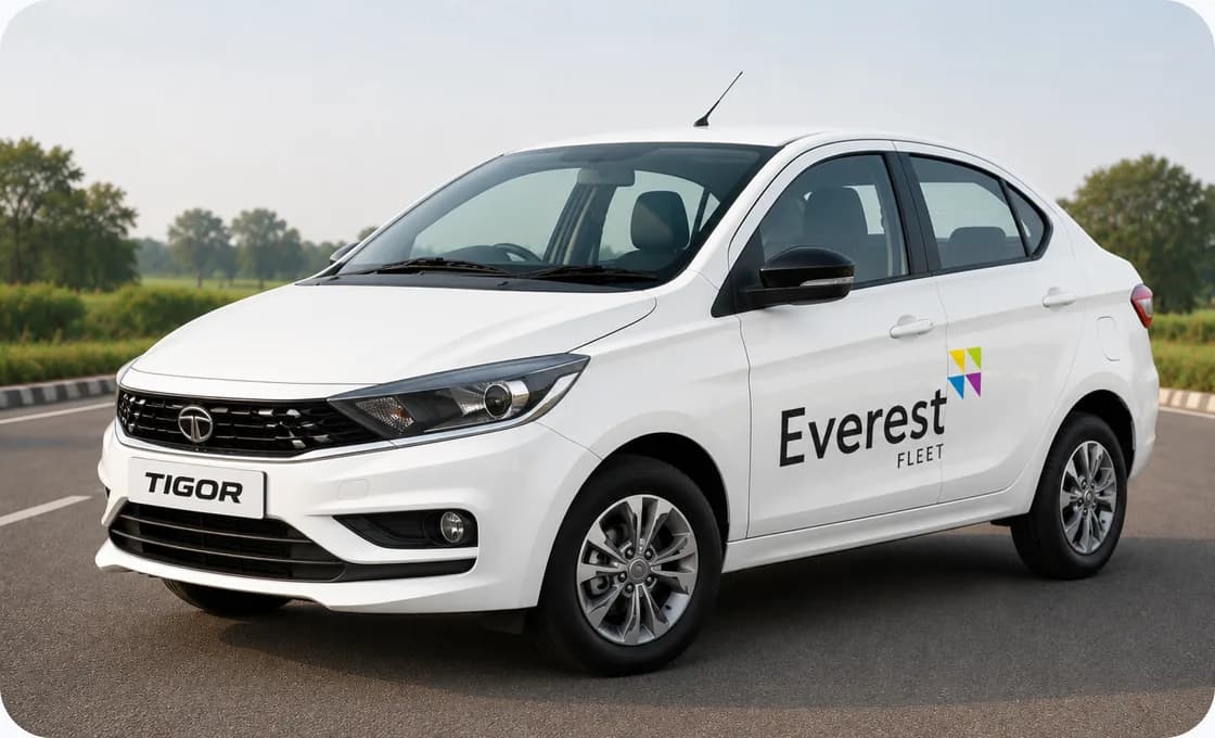 White Everest Fleet Tata Tigor on an open road
